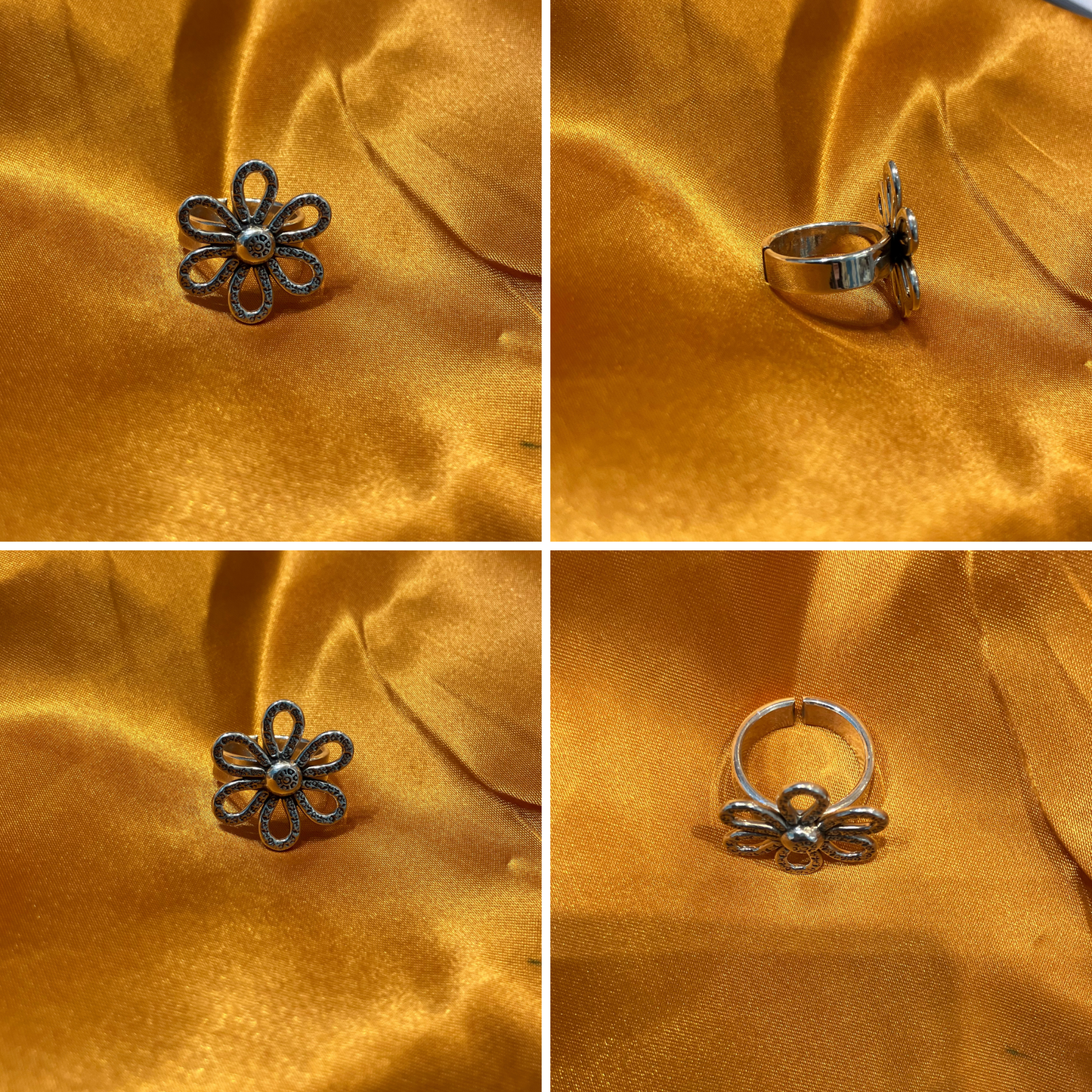 Handmade silver flower ring on golden fabric, adjustable size, showcasing intricate craftsmanship and design.